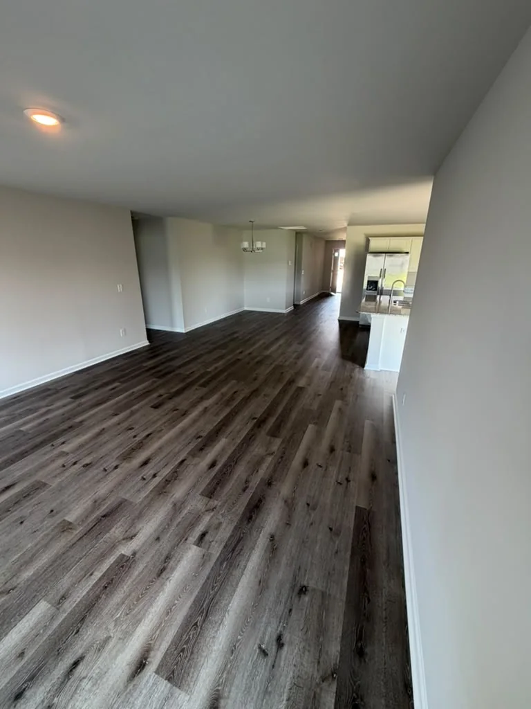Dark wood-look vinyl flooring installed in a living area